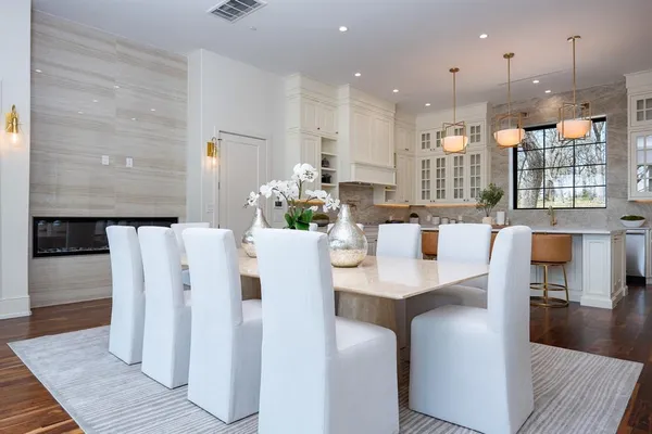 a view of kitchen with dining room and wooden floor
