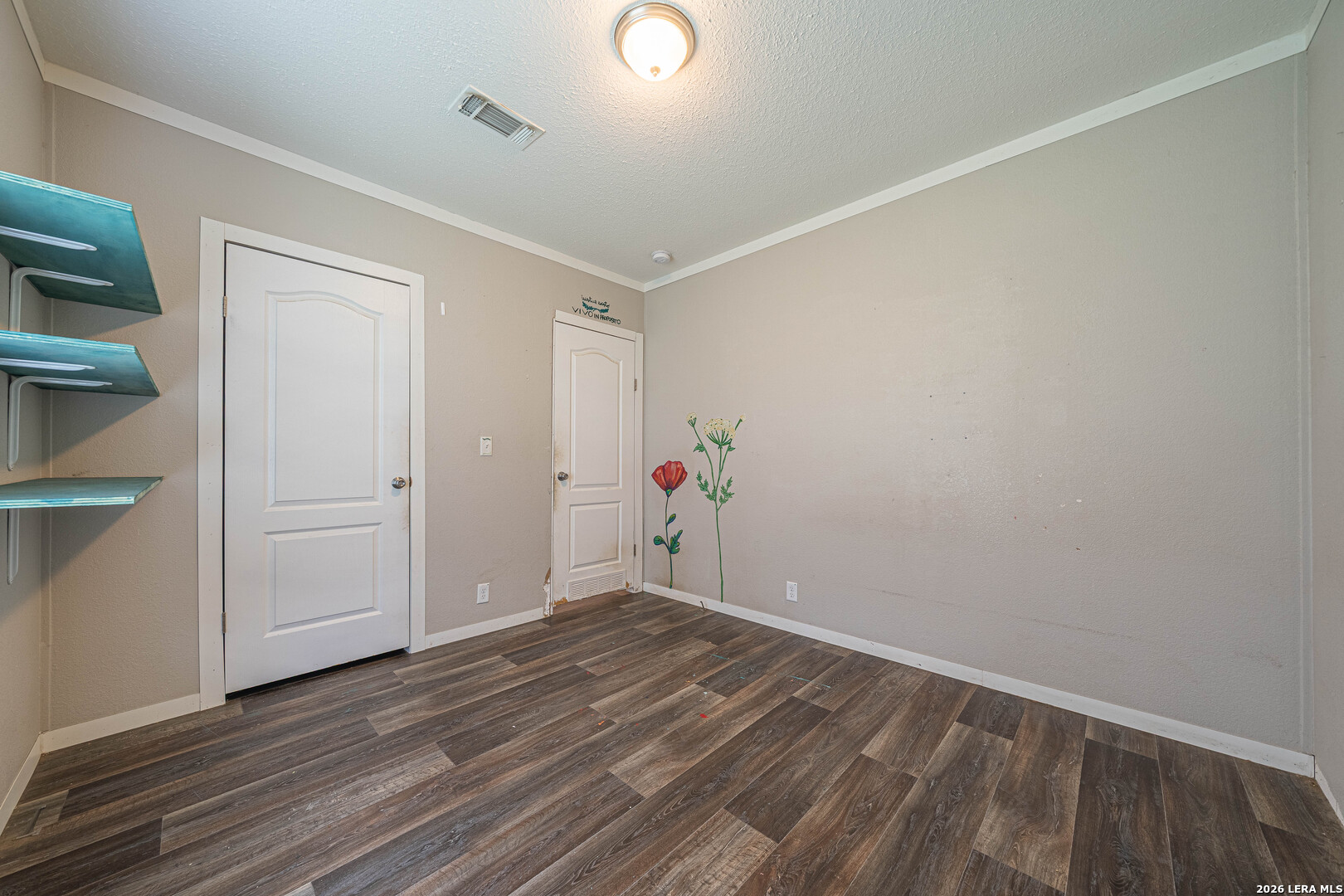 3433 Gander Slough Road Kingsbury, TX 78638 - Photo 19 of 23 an empty room with wooden floor and closet