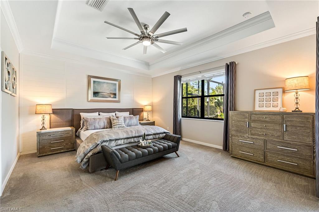 4686 Abaca Circle Naples, FL 34119 - Photo 18 of 47 a bedroom with a bed and a window