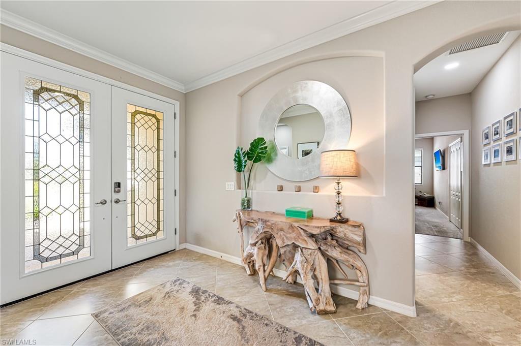 4686 Abaca Circle Naples, FL 34119 - Photo 4 of 47 a living room with furniture and a window