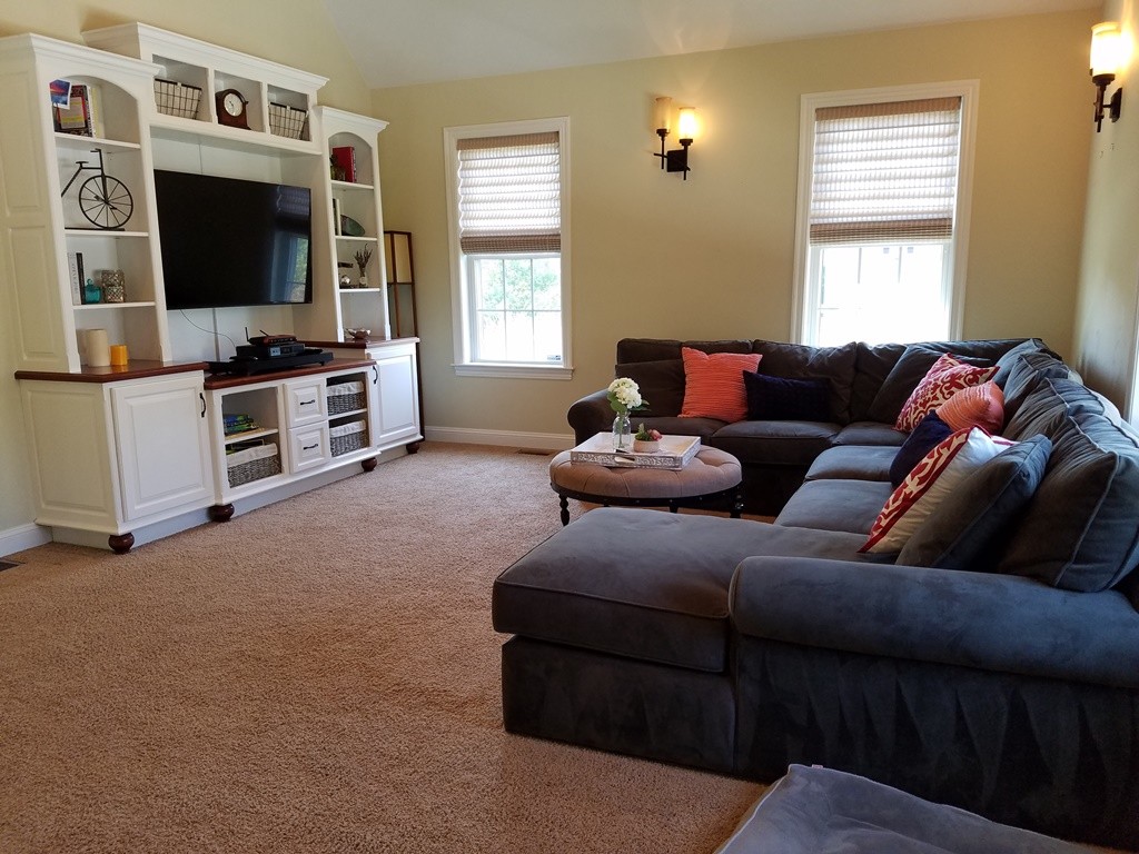39 Ridgewood Street Ashland, MA 01721 - Photo 12 of 30 a living room with furniture and a flat screen tv