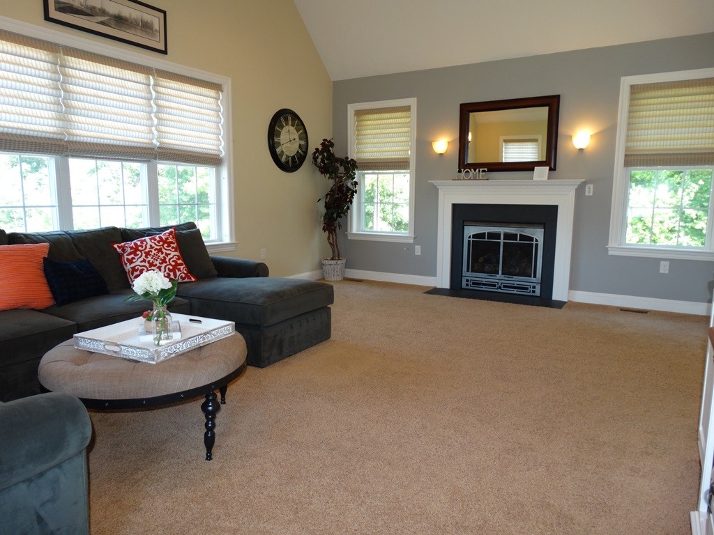 39 Ridgewood Street Ashland, MA 01721 - Photo 14 of 30 a living room with furniture and a fireplace