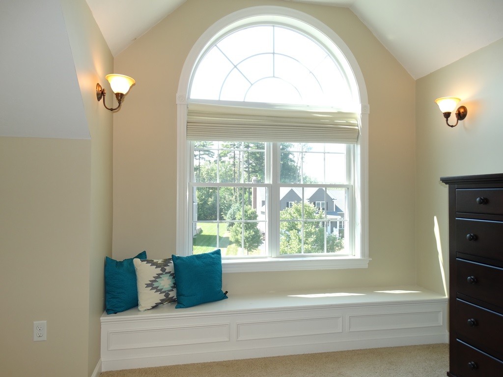 39 Ridgewood Street Ashland, MA 01721 - Photo 22 of 30 a bathroom with a bathtub and a window