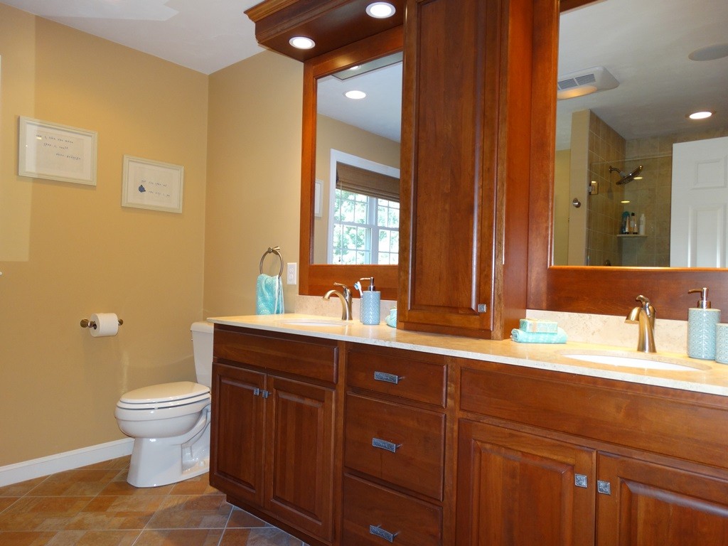 39 Ridgewood Street Ashland, MA 01721 - Photo 23 of 30 a bathroom with a granite countertop toilet sink and mirror
