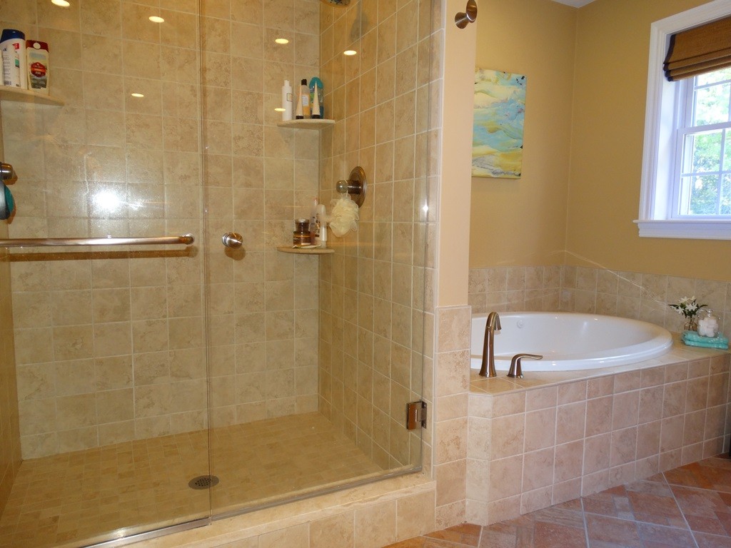 39 Ridgewood Street Ashland, MA 01721 - Photo 24 of 30 a bath room with a bath tub and shower