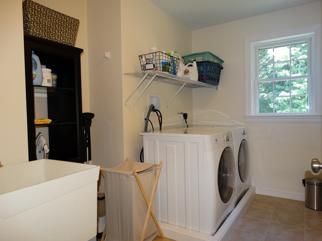 39 Ridgewood Street Ashland, MA 01721 - Photo 25 of 30 a utility room with dryer and washer