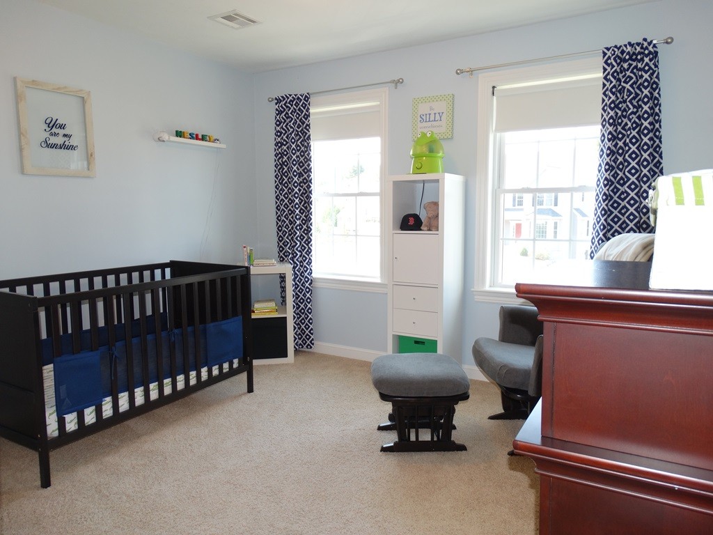 39 Ridgewood Street Ashland, MA 01721 - Photo 26 of 30 a bedroom with furniture and a window