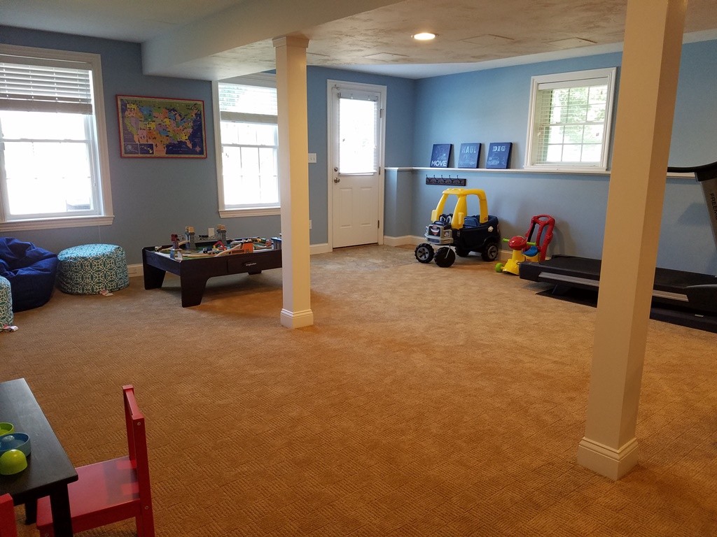 39 Ridgewood Street Ashland, MA 01721 - Photo 29 of 30 a view of a livingroom with furniture and windows