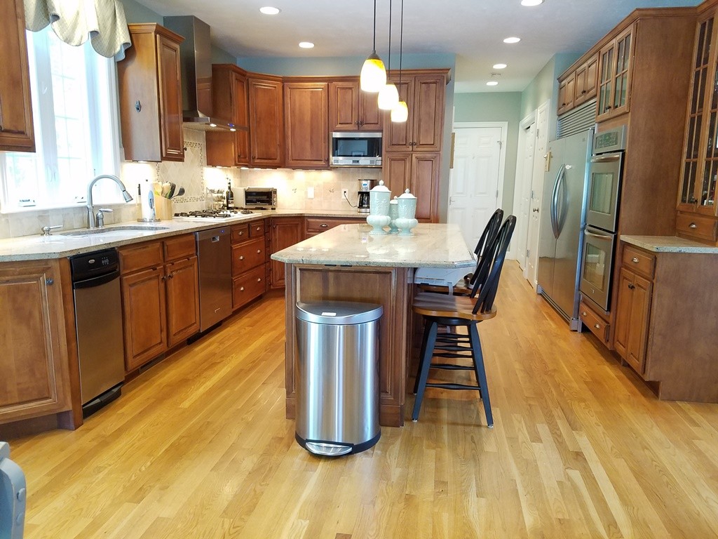 39 Ridgewood Street Ashland, MA 01721 - Photo 5 of 30 a kitchen with a sink appliances and cabinets