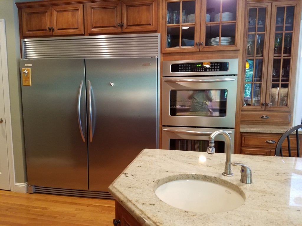 39 Ridgewood Street Ashland, MA 01721 - Photo 6 of 30 a bathroom with a granite countertop sink and washing machine
