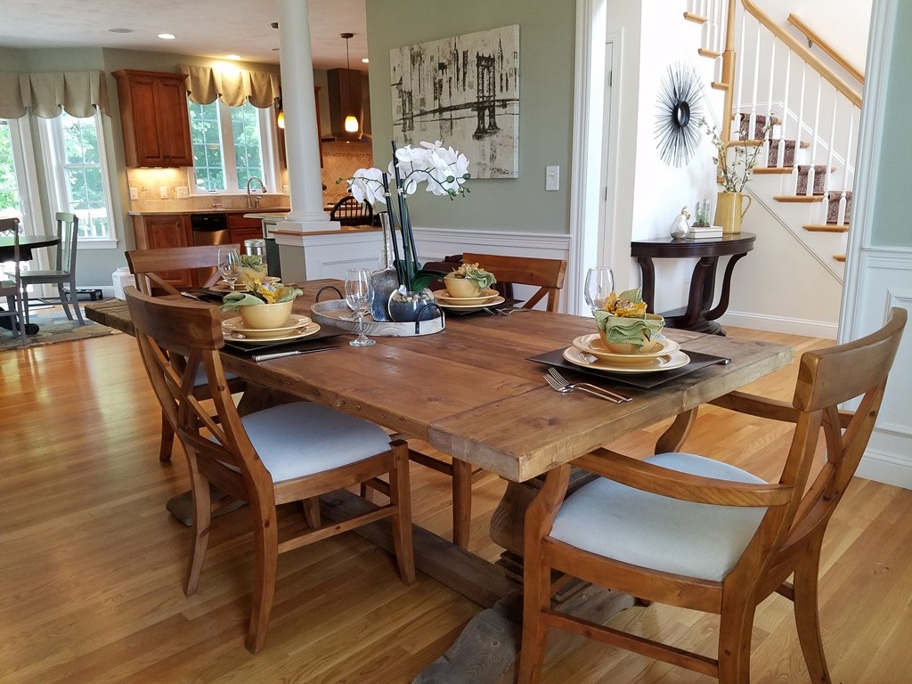 39 Ridgewood Street Ashland, MA 01721 - Photo 10 of 30 a view of a dining room with furniture and wooden floor