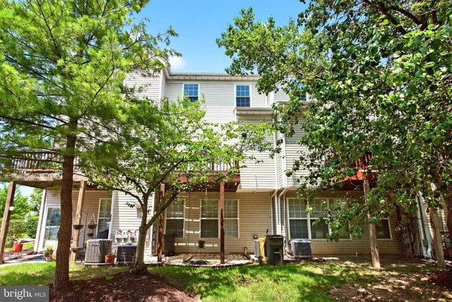 front view of a house with a tree