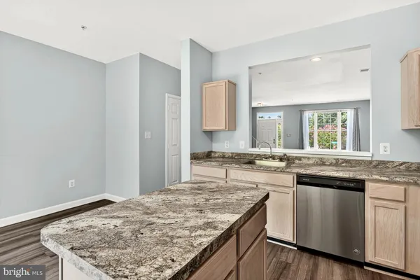 a kitchen with a stove and a sink