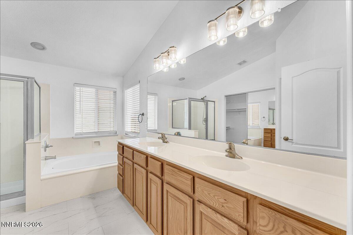 2329 Red Maple Court Reno, NV 89523 - Photo 22 of 39 a bathroom with a tub sink and mirror