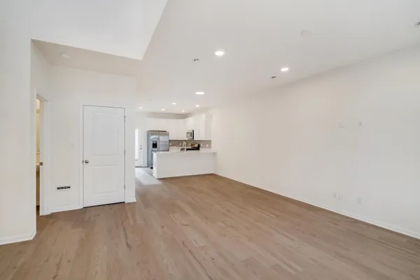 a view of a kitchen with wooden floor