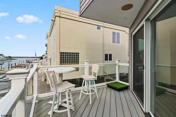 a patio with table and chairs
