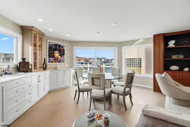 a balcony with table and chairs