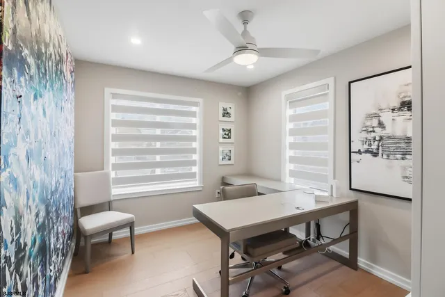 a living room with furniture a window and a kitchen