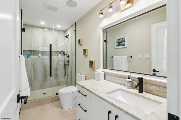 a kitchen with a stove a sink and a refrigerator