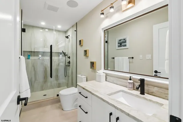 a kitchen with a stove a sink and a refrigerator