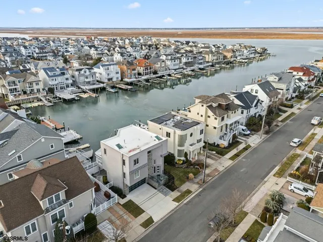 an aerial view of a city with ocean view