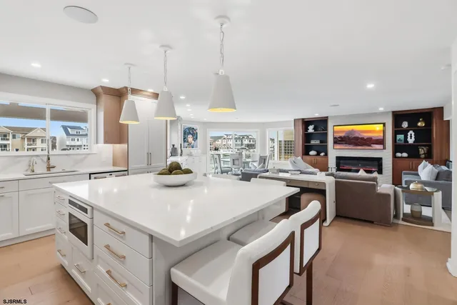 a living room with fireplace furniture and a flat screen tv