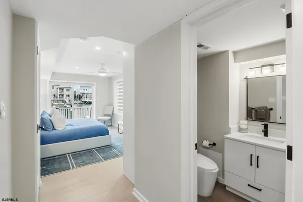 a bedroom with a large bed and a window