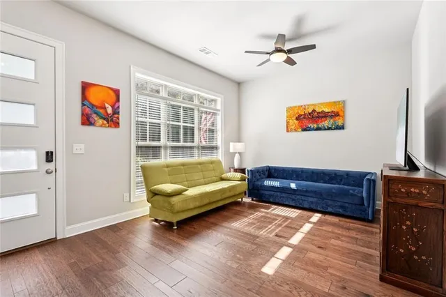 a living room with furniture and a flat screen tv