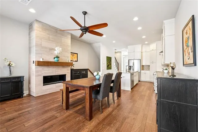 a view of a dining room with furniture window and wooden floor