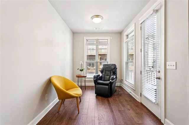 a living room with furniture and a windows