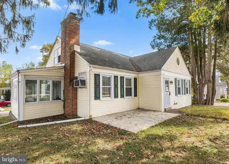 a view of a house with a snow in the yard
