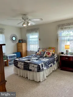 a bed room with furniture and window