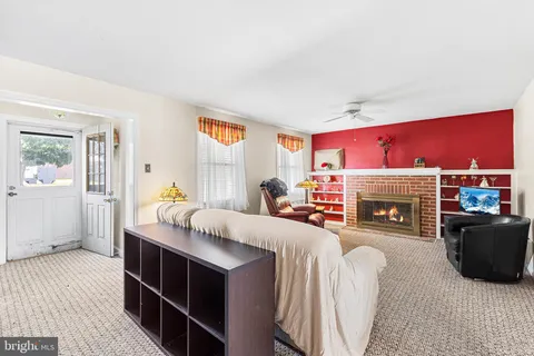 a bed room with a bed and a fireplace