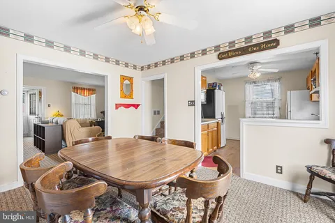 a dining room with a table and chairs