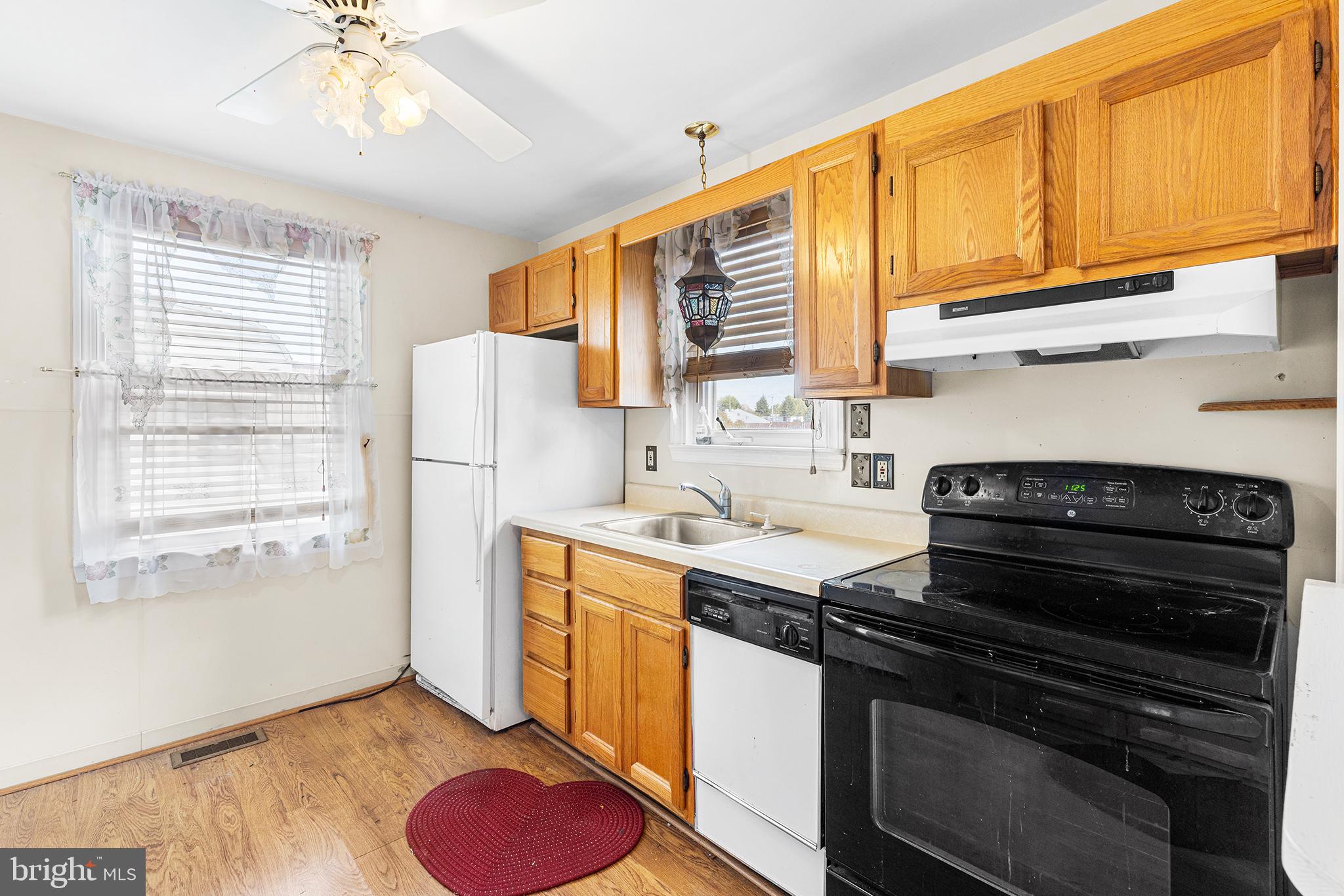 2839 Springfield Road Broomall, PA 19008 - Photo 9 of 18 a kitchen with a stove a sink and a refrigerator