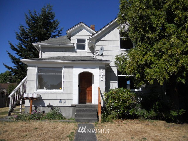 1814 Rockefeller Avenue Everett, WA 98201 - Photo 1 of 1 a front view of a house with plants and garage