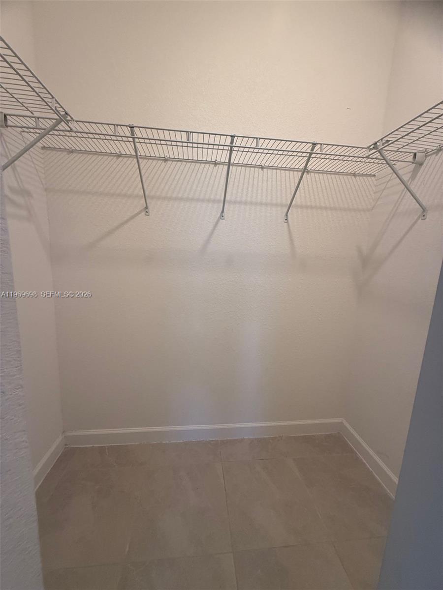 11859 Southwest 241st Street, Unit 1 Homestead, FL 33032 - Photo 6 of 7 a view of a rack on the wall
