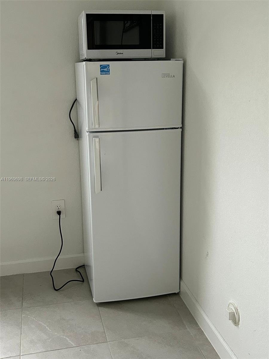 11859 Southwest 241st Street, Unit 1 Homestead, FL 33032 - Photo 7 of 7 a utility room with dryer and washer