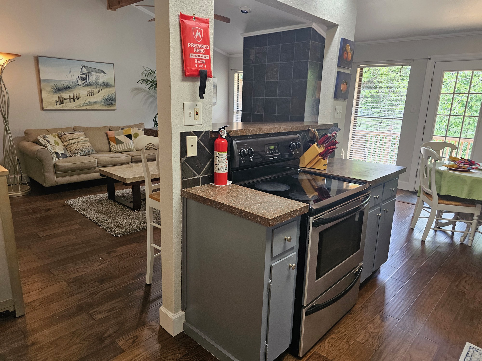 5107 Leralynn Street, Unit 304 Austin, TX 78751 - Photo 28 of 28 Kitchen featuring dark wood-style floors, open floor plan, stainless steel electric range