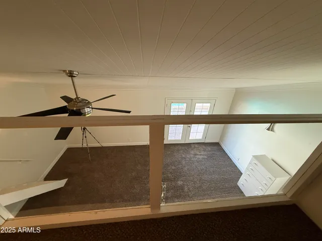 a bathroom with a shower and a sink