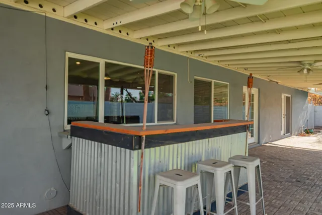 a view of a backyard with swimming pool