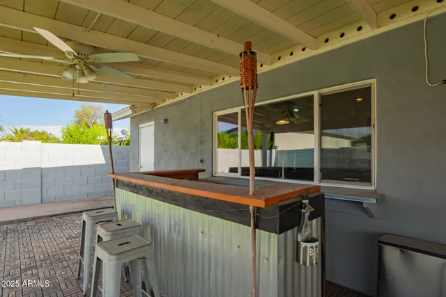 a view of a backyard with swimming pool