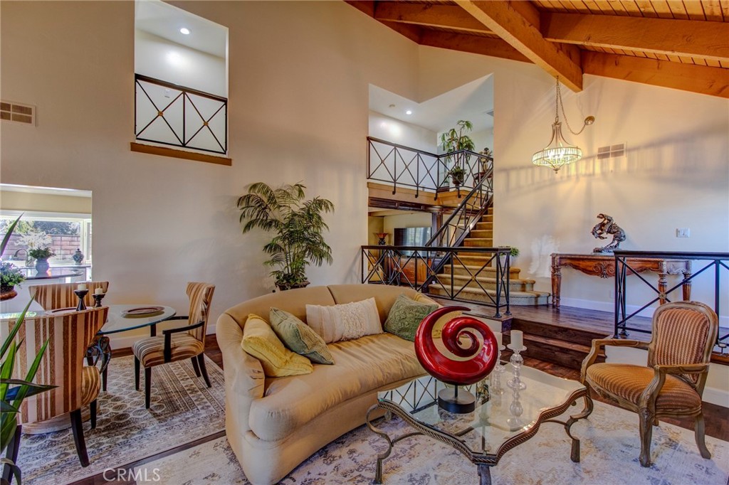22911 Rumble Drive Lake Forest, CA 92630 - Photo 2 of 3 a living room with furniture a rug and a wall painting