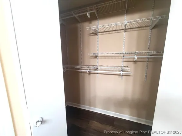 a bathroom with a sink double vanity granite tub shower and a mirror