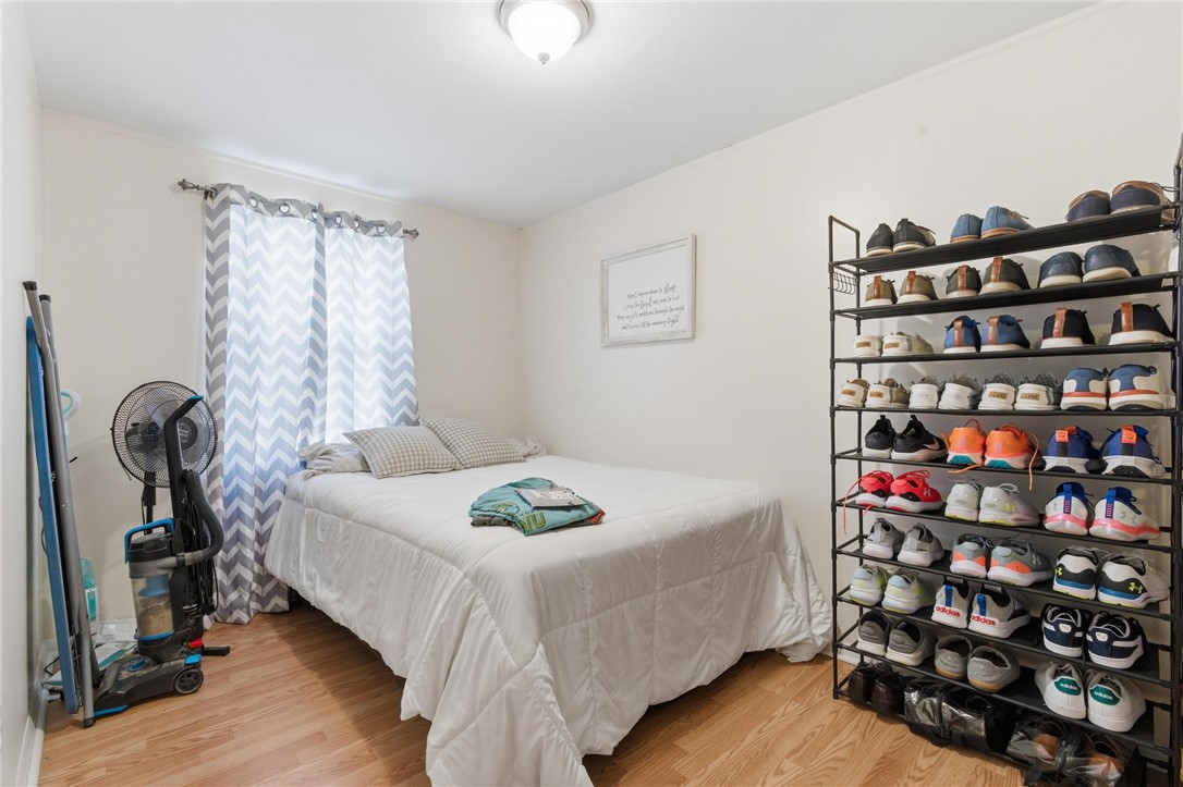 707 West Martindale Road Union, OH 45322 - Photo 12 of 28 This cozy bedroom features warm wood flooring and ample natural light, perfect for peaceful living.