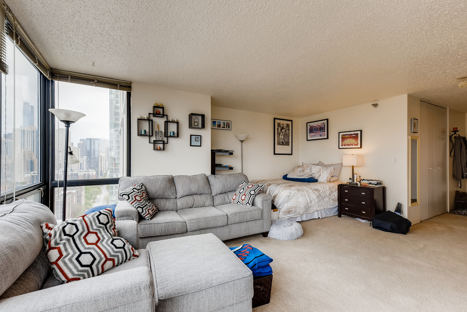 1122 North Clark Street, Unit 2207 Chicago, IL 60610 - Photo 7 of 14 a living room with furniture and a couch