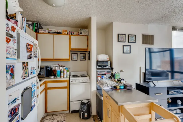 a room with furniture a rug and a window