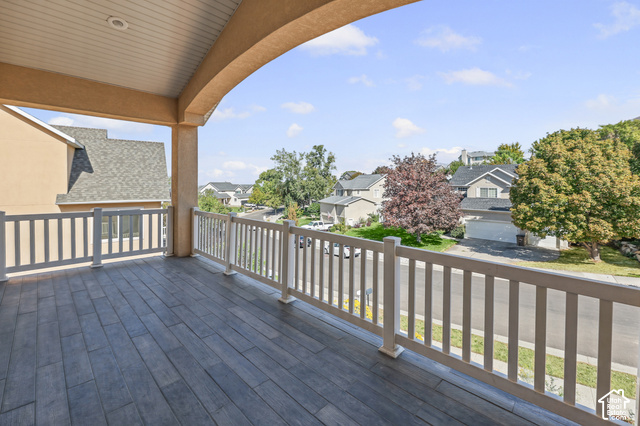 14038 New Saddle Road Draper, UT 84020 - Photo 38 of 46 Covered balcony with wood-finish flooring and white railing