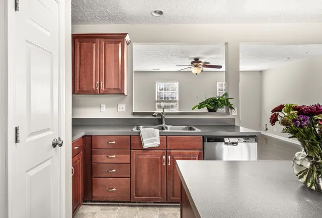 a kitchen with a refrigerator and a sink