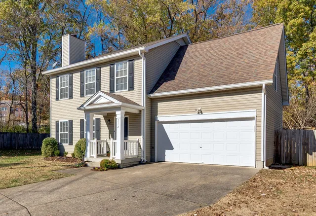 a view of brick house with large windows